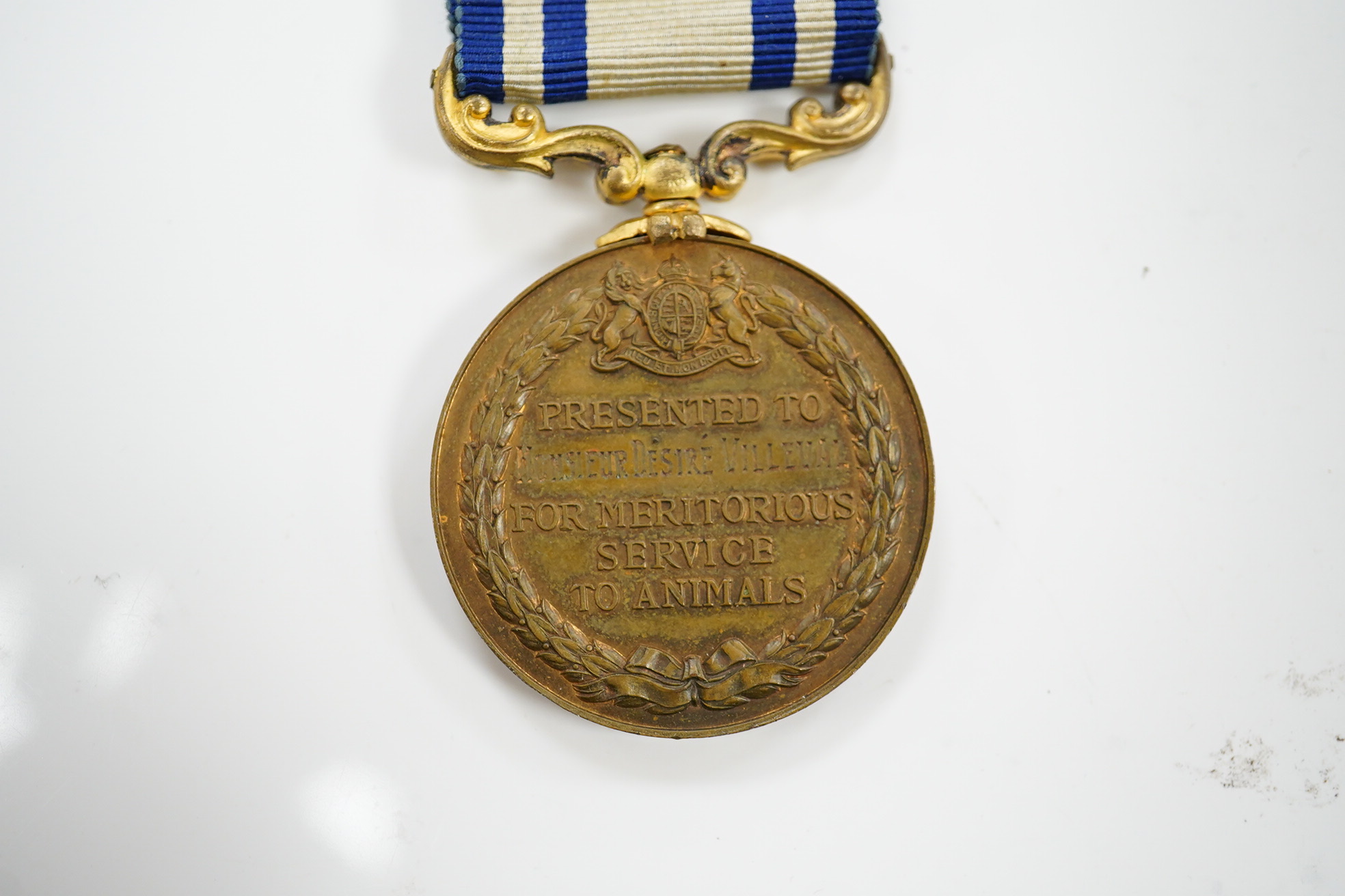 A bronze RSPCA Medal for Meritorious Service to Animals, to Monsieur Desire Villeval